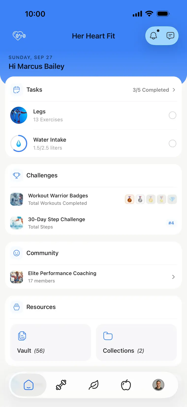 A coach's own branded app, Her Heart Fit, in blue: the client's home with tasks, challenges and community