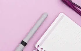 Weekly check-in cover: notebook and pen on pink